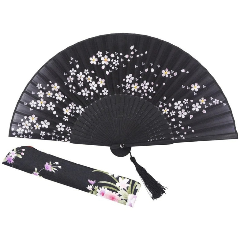 Folding silk fan on openwork bamboo ribs, black, with white and pink cherry blossoms and a braided tassel
