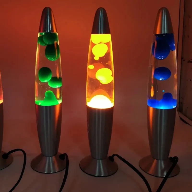 Three Lava Lumes lit up in green, orange and blue