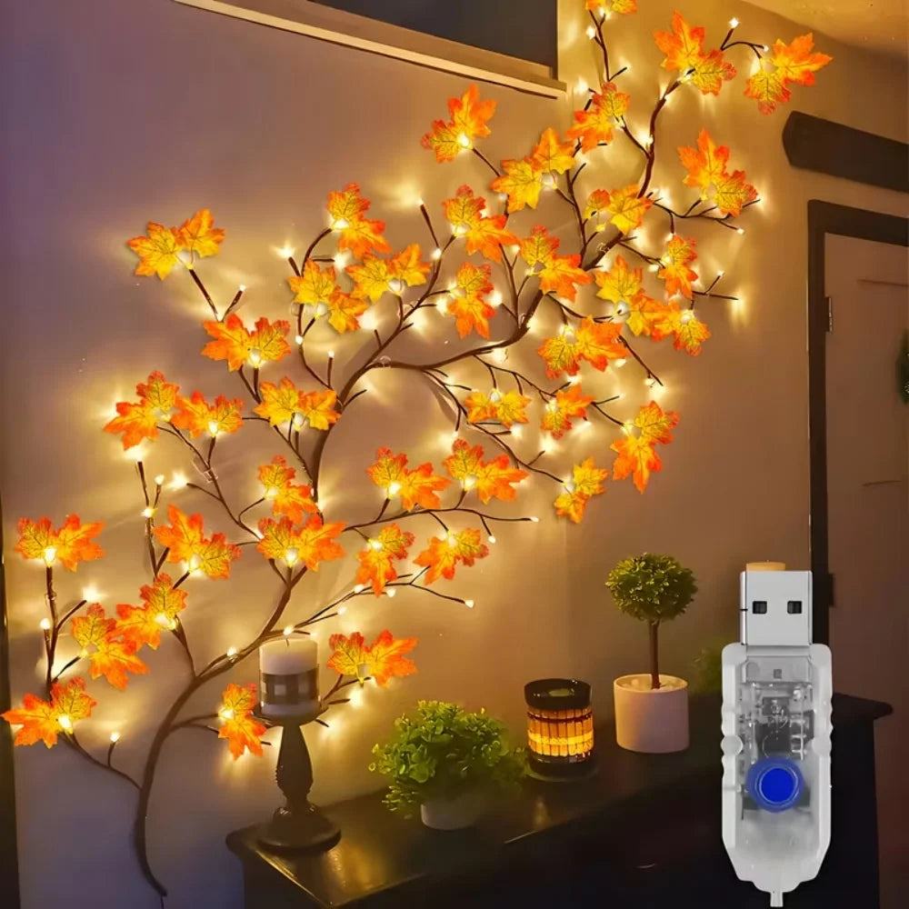 Maple Lights with orange leaves climbing a wall above a shelf, next to its USB plug