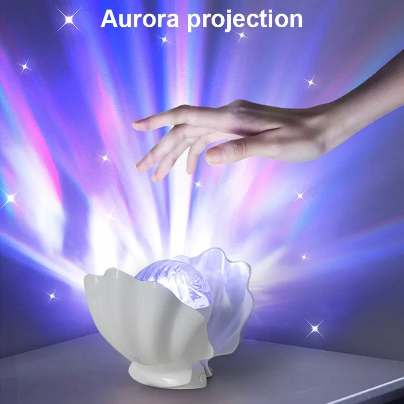 A hand above Shell Lume and its purple and green aurora