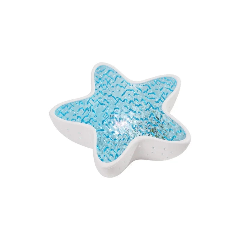 Starfish Lume lit up, on a white background